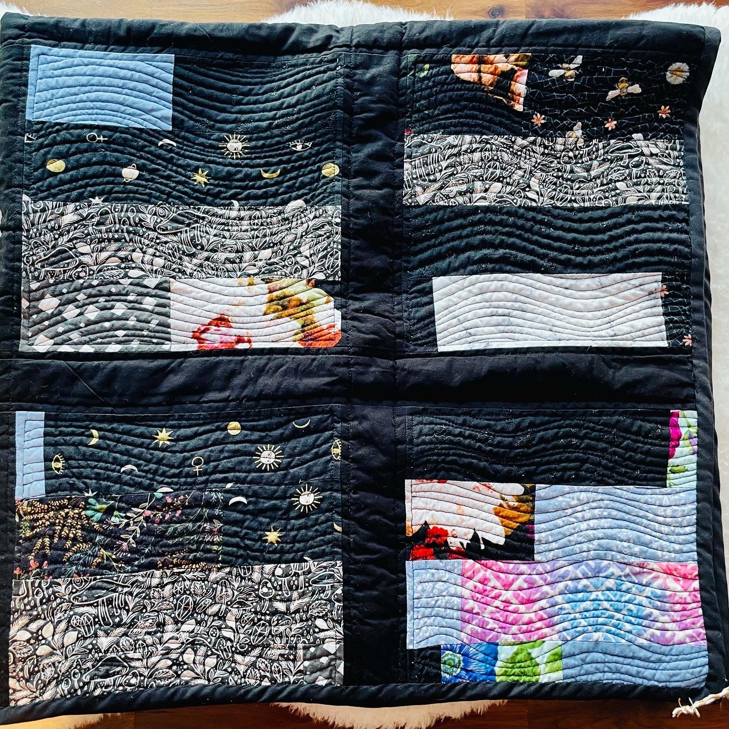 Quilt in Black, Blue, Violet and Grey.